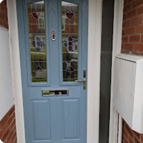 Blue composite front door installed by WSQ Builders